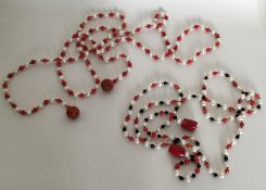 A long string of coral and pearl beads together wi