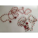 A long string of coral and pearl beads together wi