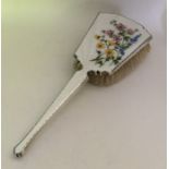 An attractive silver and enamelled hairbrush depic