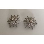 BRIDAL JEWELLERY: A pair of stylish silver ear cli