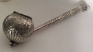 A large Continental silver ladle chased with flowe