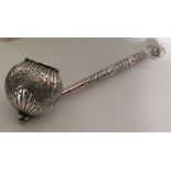 A large Continental silver ladle chased with flowe