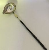 A Georgian silver toddy ladle with whalebone handl