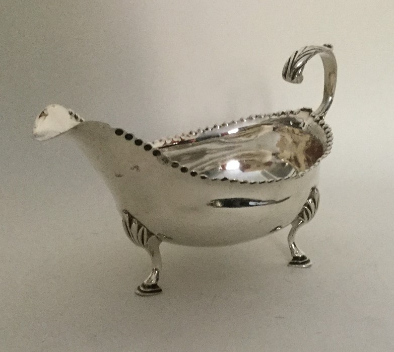 A good Georgian silver sauce boat with card cut ri