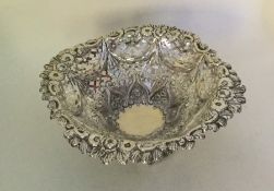 A good quality silver embossed sweet dish on sprea