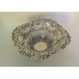 A good quality silver embossed sweet dish on sprea