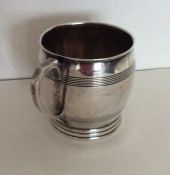 A heavy Edwardian silver christening cup of Art De