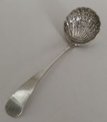 An Edwardian silver sifter spoon with pierced bowl