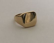 A large plain gold signet ring. Approx. 9 grams. E