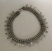 A Victorian silver collar with pierced and engrave