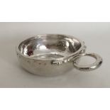 A heavy 18th Century French silver wine taster wit