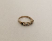A 9 carat sapphire and diamond half eternity ring