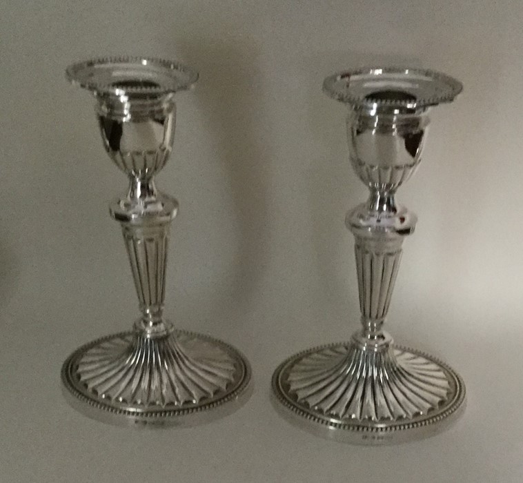 A pair of attractive Edwardian silver candlesticks