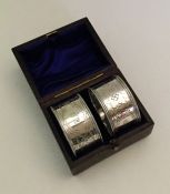 An attractive pair of boxed silver napkin rings. S