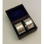 An attractive pair of boxed silver napkin rings. S