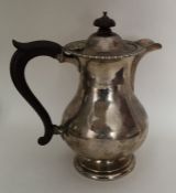 A silver hot water jug with reeded border. Birming