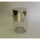 A silver and glass hinged top scent bottle. Birmin