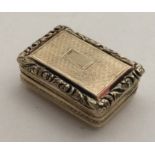 A silver gilt rectangular cast vinaigrette. London