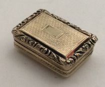 A silver gilt rectangular cast vinaigrette. London