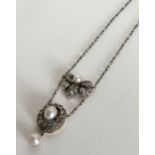 An attractive Victorian boxed pearl and diamond pe