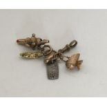 A novelty miniature gold child's rattle together w
