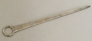 A large George III silver meat skewer with crested