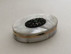 A Continental MOP and gold mounted oval box set wi