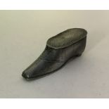 An unusual pewter snuff box in the form of a shoe