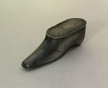 An unusual pewter snuff box in the form of a shoe