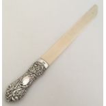 A large silver mounted paper knife embossed with f