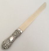 A large silver mounted paper knife embossed with f