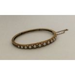 An attractive 15 carat pearl bangle with concealed