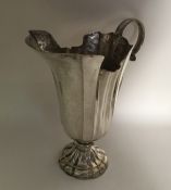 A large Italian silver ewer on spreading support.
