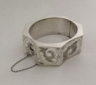 A stylish silver bangle of octagonal form. Approx.