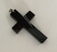 A large banded agate cross with silver loop top. A
