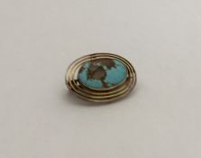 MURRLE BENNETT: An oval turquoise brooch with reed