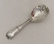 A silver hourglass pattern silver caddy spoon. Lon