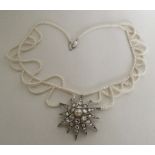 BRIDAL JEWLLERY: An attractive silver star mounted