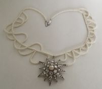 BRIDAL JEWLLERY: An attractive silver star mounted