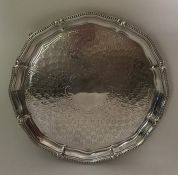 A good quality Victorian silver salver with beaded