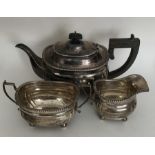 A heavy Edwardian silver three piece tea service w