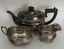 A heavy Edwardian silver three piece tea service w