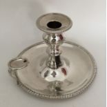 An Antique AMerican silver chamber stick with reeded border