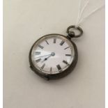 A silver engraved fob watch with white enamelled d