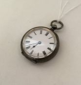 A silver engraved fob watch with white enamelled d