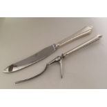 A good silver and steel carving knife and fork. Sh