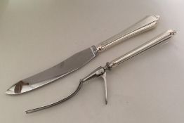 A good silver and steel carving knife and fork. Sh