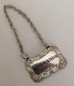 A silver plated wine label for 'Hollands'. Est. £1