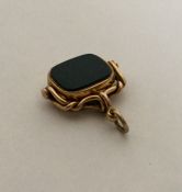 A good 15 carat gold swivel fob mounted with blood