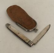 A Georgian silver and MOP fruit knife contained wi